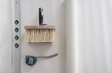 Top view close up wide paint brush for glue with wooden base for bristle,black handle,construction...