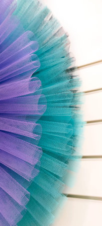 Fragment pair of colorful ballet tutus.Abstract close-up selective focus purple and bluish green...