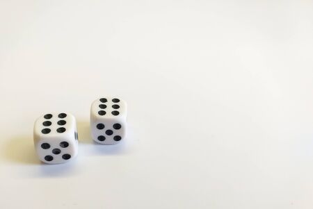Dice in white with black dots with a successful combination isolated on a white background. Great space for text. Good luck in the game. Victory concept. Gambling conceptの写真素材