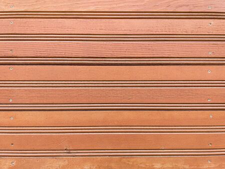 Vintage brown wooden texture of textured boards. Background from an old painted wooden wall. Brown abstract background. Vintage wooden dark horizontal boards. Front view with copy space.の写真素材