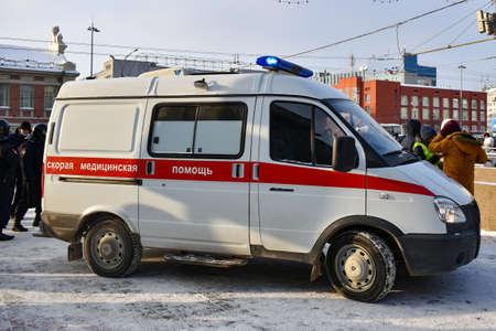 An ambulance stands on the square where a protest rally in support of Navalny is taking place. Novosibirsk, Russia - January 23, 2021のeditorial素材