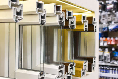 cutaway plastic windows. PVC window profiles are in row in hardware store. Close-up of reinforced-plastic window structure.の写真素材