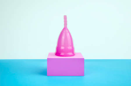 Reusable eco-friendly menstrual cup on the podium. There is a menstrual cup on the pedestal. Alternative menstrual cycle, female healthcare conceptの写真素材