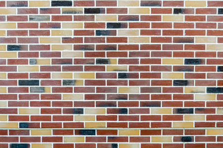 large texture of colored facing bricks. brick wall background. textured bricks. Background texture...