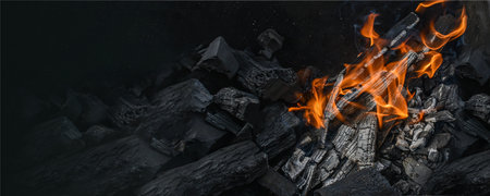 hot charcoal and flame of fire. texture of flaming burning firewood. Wide banner, flame backgroundの写真素材