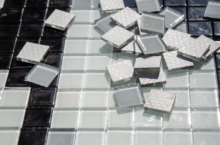 glass ceramic mosaic tiles for creativity. White glossy tiles, laid out in the workspace, prepared for making mosaicsの写真素材