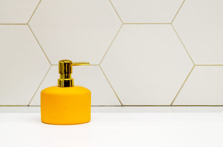 dispenser for liquid in bathroom. bottle of detergent or antiseptic, Elegant decor bathroom interior