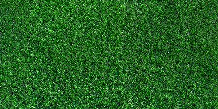 Green grass background, banner. Turf, soccer field, green grass artificial turf, texture, top view. summer lawn backgroundの写真素材
