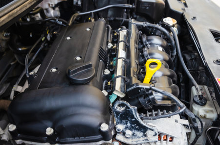 Car engine close-up. Close up of car parts under hood after maintenance and washingの写真素材