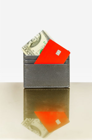 credit card and cash in cardholder on white background. Money and card in wallet, space for text