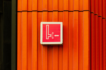 sign on facade of building indicating location of fire hydrant, standpipe, for connecting fire hoseの写真素材