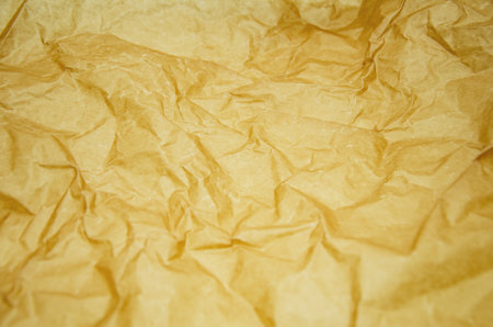 Crumpled brown paper. Abstract wrinkled recycled paper textureの写真素材