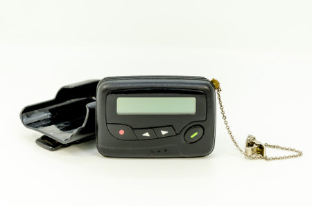 pager in close-up, an old retro communication device on white backgroundの写真素材