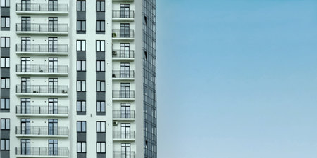 Modern Apartment Building Facade Against Clear Sky
