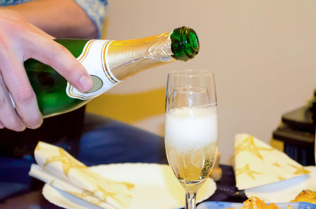 Pouring Champagne Into a Glassの写真素材