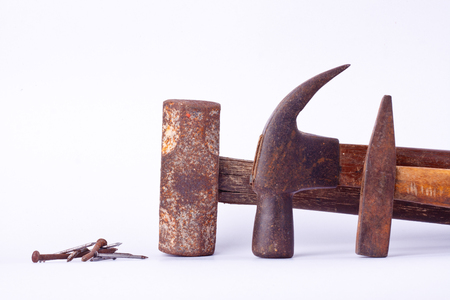 old Traditional curved claw hammer and Tack hammer and Sledge hammer and rust nail tack used on white background tool isolatedの写真素材
