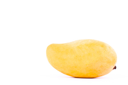 yellow sweet ripe mango on white background healthy fruit food isolatedの写真素材