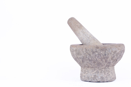 stone mortar and pestle are Thai cooking tool on white background food isolatedの写真素材
