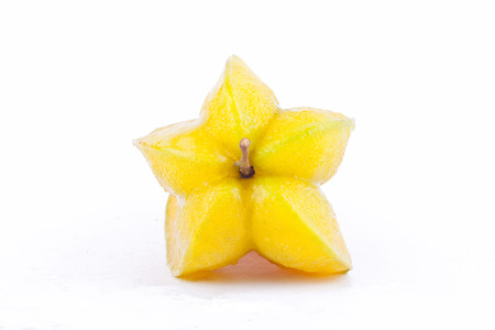 ripe star fruit carambola or star apple ( starfruit ) on white background healthy fruit food isolatedの写真素材