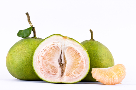 fresh green pomelos peeled on white background healthy fruit food isolatedの写真素材
