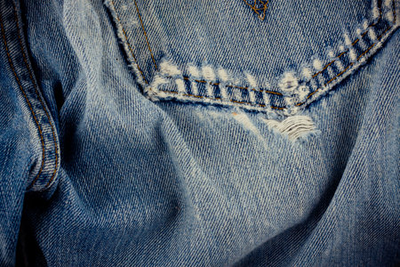 Defective jeans background denim with a seam of vintage fashion design denim texture