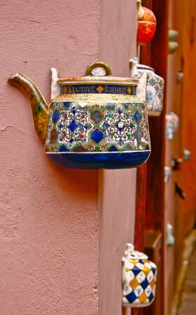 Old ceramic kettle masoned into the wallの写真素材