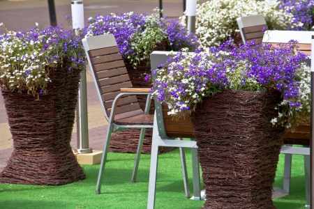 Outdoor restaurant with flowersの写真素材