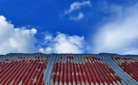 Old iron roof with cloud and blue sky