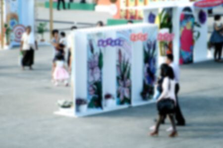 Abstract blurred people at outdoor event or exhibitionの写真素材