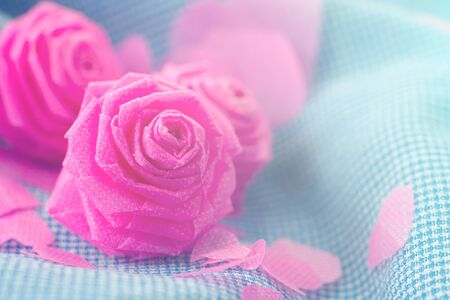 Pink rose and small hart on blue cloth background for Valentine festival. vintage color styleの写真素材