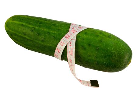 Cucumber wrap a measuring tape isolated on whiteの写真素材