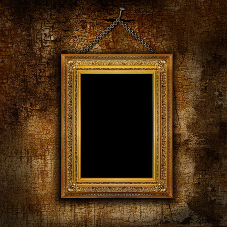 Frame of the painting hanging on a chain on a cracked wall