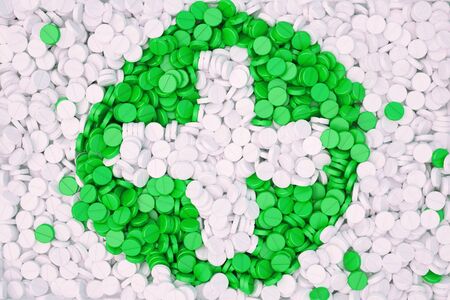 a lot of tablets forming the shape of the medical cross.の写真素材