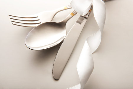 cutlery - knife, spoon and fork tied ribbon