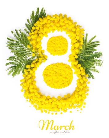 Greeting Card International Women's Day on March 8th. Branches of mimosa in the form of number eightの写真素材