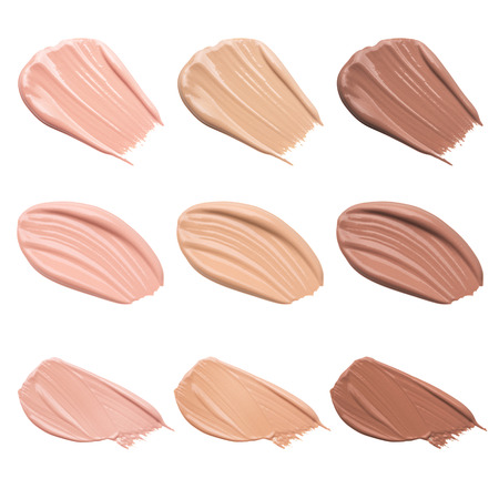 Smears of foundation for face.A smear of lipstick. Cosmetic smear of liquid. Isolated on white backgroundの写真素材