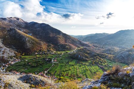 Stunning landscape of a mountain valley with a small village.の写真素材