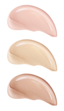 Smears of foundation for face.A smears of lipstick. Cosmetic smears of liquid. Isolated on white backgroundの写真素材