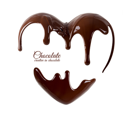 Chocolate in the form of heart. Melted chocolate syrup on white background.の写真素材