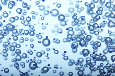Oxygen bubbles in clear blue water, close-up. Mineral water. Water enriched with oxygen.の写真素材