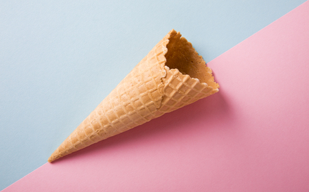 Empty cone waffle on a colored background.の写真素材
