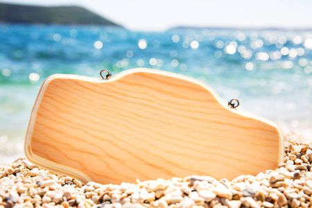Sign in the sand on the beach. Wooden signpost on the beach.の写真素材