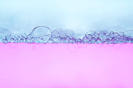 Transparent gel with bubbles close-up. The texture of gel cream. Oxygen bubbles in clear blue water, close-up. Mineral water. Water enriched with oxygen.の写真素材