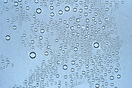 Water Drops. Bubbles close-up. The texture of gel cream. Oxygen bubbles in clear blue water,...