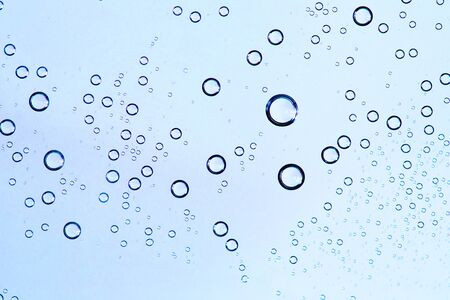 Water Drops. Bubbles close-up. The texture of gel cream. Oxygen bubbles in clear blue water, close-up. Mineral water. Water enriched with oxygen.の写真素材