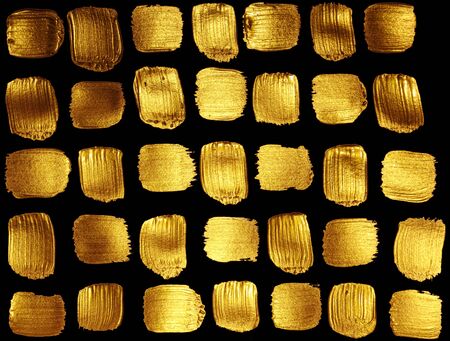 Shiny golden texture. Golden background. Smears of golden paint.の写真素材