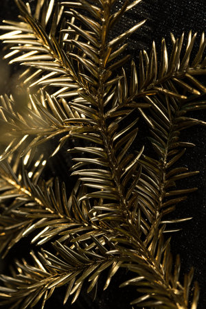 Christmas card. Golden Christmas tree close-up for design postcards. Luxury greeting card for the...