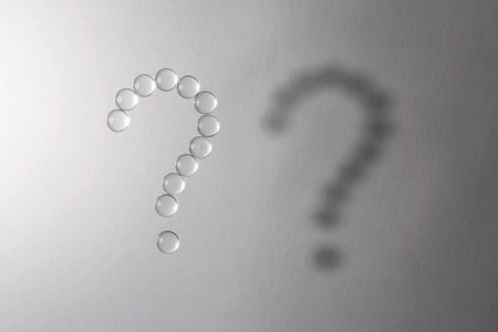 Question mark. Abstract banner with a question mark. Question mark made of drops.