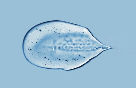 Transparent gel with bubbles close-up. Smear of face gel cream. The texture of gel cream. A sample...