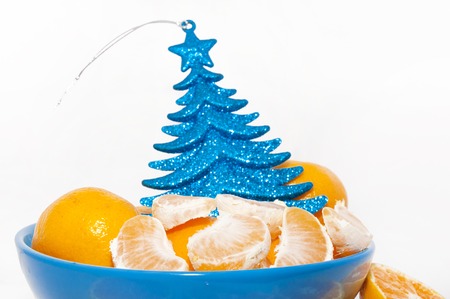 Mandarins on blue plate  Christmas and New Year traditionの写真素材